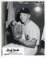 Mickey Mantle - New York Yankees - seated in locker room pointing to glove - B/W - MantleMickey-3040.jpg - 8x10